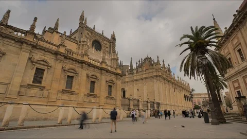 Time lapse of people walking by the Gothic Sevilla Cathedral, Seville, Spain. Stock Footage 124550622