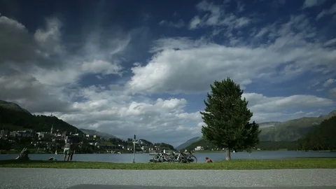 Time lapse of people walking by the lake of Saint Moritz in Switzerland. 4K.  Stock Footage 78782880