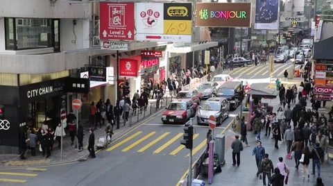Time Lapse of people walking through a zebra crossing in downtown Hong Kong Stock Footage 45379683