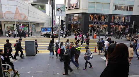 Time Lapse of people walking through a crossing in downtown Hong Kong Stock Footage 45379795