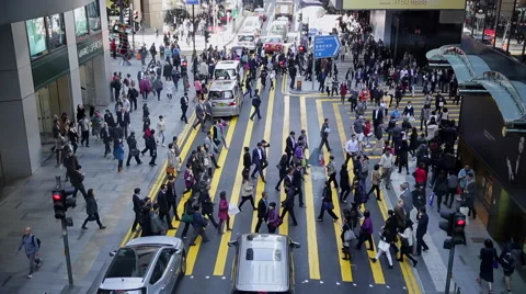 Time Lapse of people walking through a zebra crossing in downtown Hong Kong Stock Footage 45408438