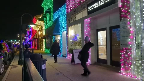 Time lapse of people walking through downtown holiday lights Stock Footage 296016687