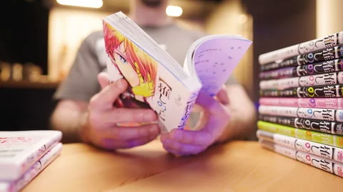 Time lapse of a person reading all Japanese manga comic Oshi no Ko 4K Stock Footage 276097308