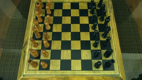 Time-lapse of a person setting up game pieces on a chess board. Stock Footage 78556531