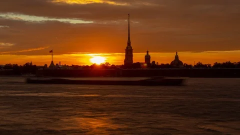 Time lapse of Peter and Paul fortress at sunset, darkness comes, boats and Stock Footage 112007262