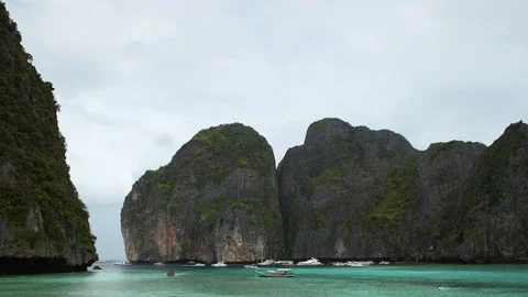 Time Lapse of Phi Phi Island Beach Long Tail Boats and Luxury Yachts in Maya Bay Stock Footage 99843012