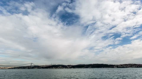 Time Lapse Photography clouds moving across the blue sky with Bosphorus Bridge Stock Footage 47563763