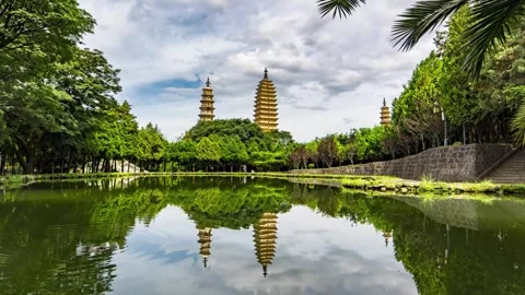 Time lapse Photography of Reflection Scenery of Three Pagodas in Lijiang Yunnan Stock Footage 336883540