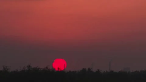 Time-lapse photography of the setting sun and the sun setting Stock Footage 327179754