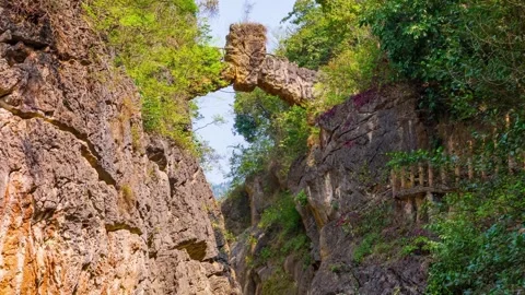 Time lapse Photography of Stone Bridge Waterfall and Stream in Huangguoshu Stock Footage 336893644