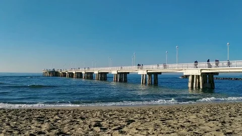 Time lapse at the pier of Marina di Massa on a sunny winter morning Stock Footage 122413612