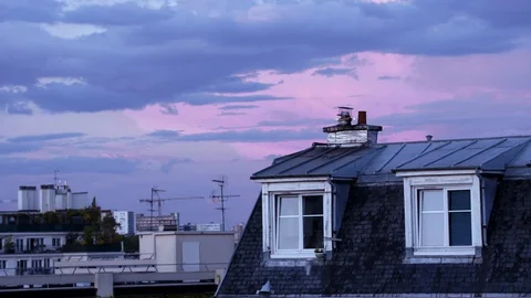 Time lapse: pink cloudy sunset above Parisian rooftops to sundown, France Stock Footage 129310464
