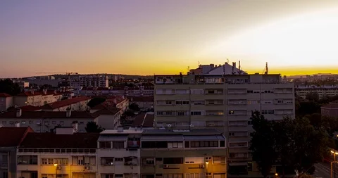 Time lapse of planes flying really close to city centre buildings at sunset Stock Footage 114886572