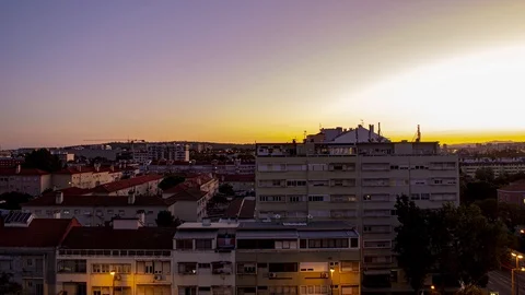 Time lapse of planes flying really close to city centre buildings at sunset Stock Footage 114886763