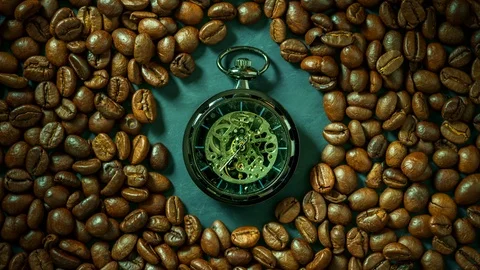 Time lapse pocket watch among coffee bean on table in morning. Stock Footage 113264476