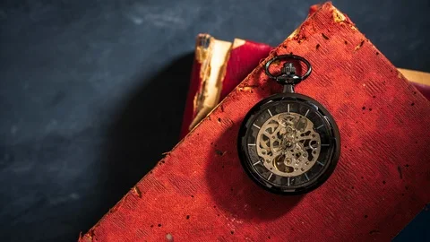 Time lapse pocket watch on old book. Stock Footage 111246523