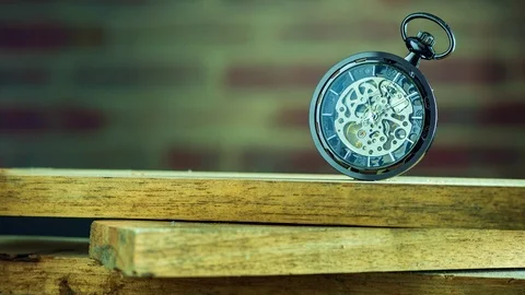 Time lapse pocket watch on stacked lumber in morning. Stock Footage 118733533