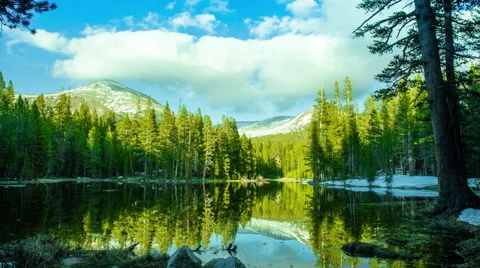 Time Lapse - Pond in the Forest with Snowy Mountain Peaks Stock Footage 42068461