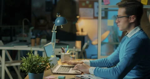 Time lapse portrait of hard-working employee busy with laptop all night then Stock Footage 187113100