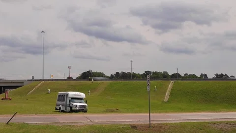 Time-lapse Prison Inmates working on the side of a highway bridge landscaping Stock Footage 153312662