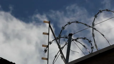 Time lapse. Prison jail security fence. Razor Wire Fencing and Barbed Wire. Stock Footage 48948629