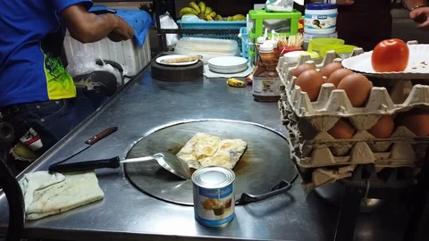 Time lapse Process of cooking exotic thai pancakes, roti Stock Footage 128758547