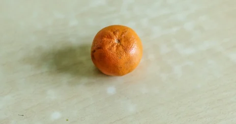 Time lapse of the process of eating mandarin Stock-Footage 129594586