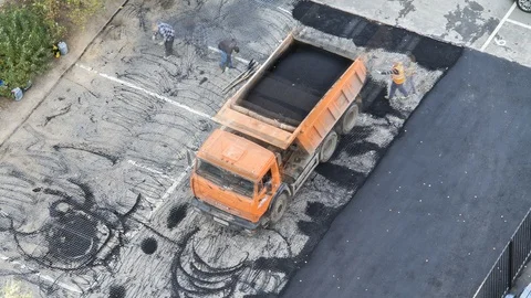 Time lapse of process of paving asphalt on the parking place. Aerial top view Stock-Footage 121224800