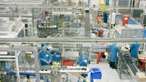 Time-lapse of production workers working on production line in cosmetic factory Stock Footage 107965100