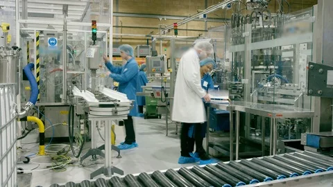 Time-lapse of productions workers and technicians working in cosmetic factory Stock Footage 107999947