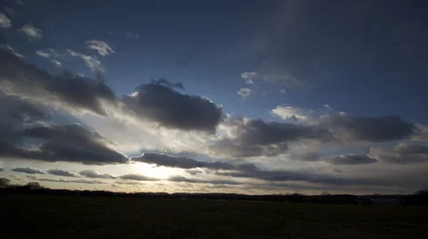 Time Lapse -  Puffy Cloud Sunset Stock Footage 39515624