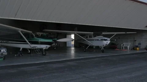 Time lapse pulling plane out of hanger Stock Footage 48981348