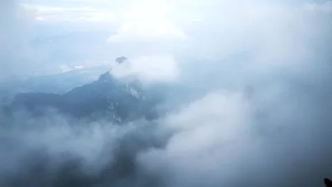 Time Lapse of Pure White Thick Mist Flowing in Mountain Canyon Stock Footage 337930540