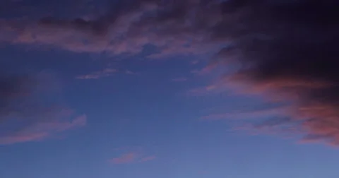 Time Lapse as purple clouds fade to night Stock Footage 47578277