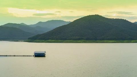 Time lapse the raft floating in dam or lake and cloud moving above mountain. Stock Footage 95231218
