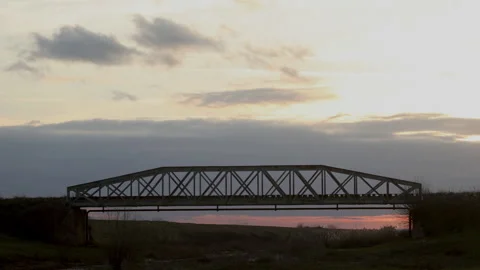 Time lapse of a railway bridge with the clouds passing by Stock Footage 229481873