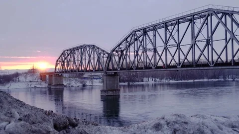 Time lapse of railway bridge over the river at dawn with a mountain forest and Stock Footage 75290524