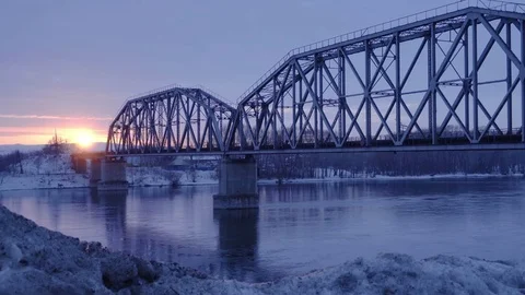 Time lapse of railway bridge over the river at dawn with a mountain forest and Stock Footage 75347974
