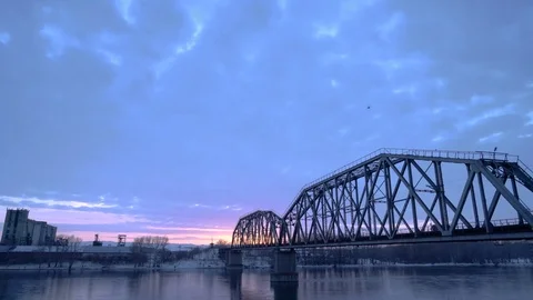 Time lapse of railway bridge over the river at dawn with a mountain forest and Video stock 75348298