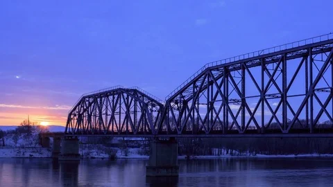 Time lapse of railway bridge over the river at dawn with a mountain forest and Video stock 75883986