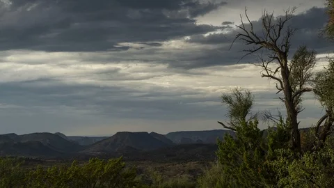 Time lapse of rain clouds forming over a desert valley Stock-Footage 92544846
