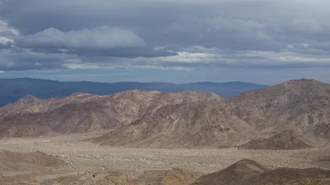 Time lapse of rain clouds over desert mountains near Palm Springs Stock Footage 87621422