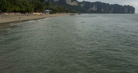 Time lapse of rain clouds over beach and sea landscape with boats. Tropical Stock Footage 116420025