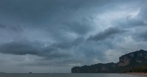 Time lapse of rain clouds over beach and sea landscape with boats. Tropical Stock Footage 116420127