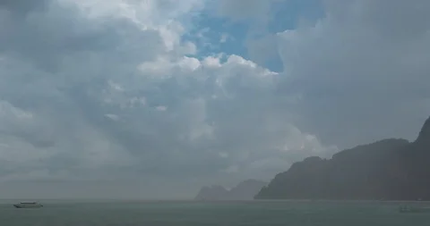 Time lapse of rain clouds over beach and sea landscape with boats. Tropical Stock Footage 116420554