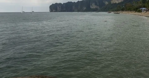 Time lapse of rain clouds over beach and sea landscape with boats. Tropical Stock Footage 119896205
