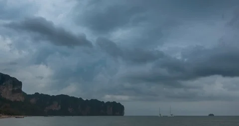 Time lapse of rain clouds over beach and sea landscape with boats. Tropical Video stock 119896259