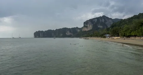 Time lapse of rain clouds over beach and sea landscape with boats. Tropical Stock Footage 155080818