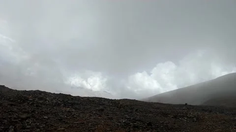 Time lapse of rain clouds passing at a barren in arid mountainous region Stock Footage 170693482