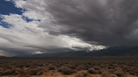Time lapse rain clouds travel over the Sierra Mountains, California, USA. Stock Footage 58109756